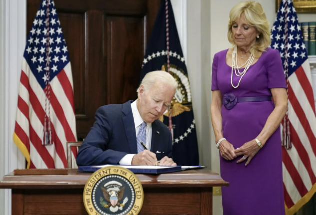 President Biden signs into law the Safer Communities Act gun safety bill. Photo by Pablo Martinez Monsivais/AP Photo.